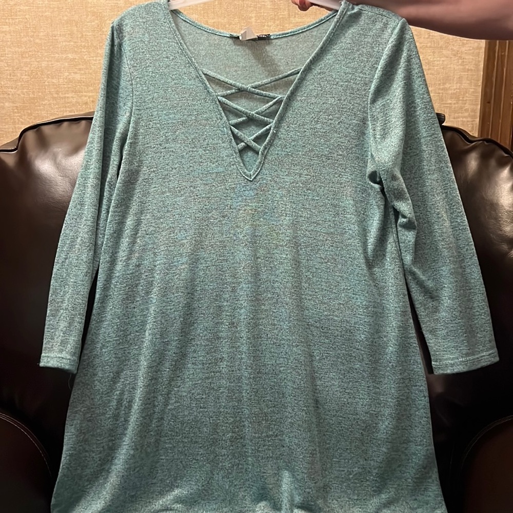Size large shirt with pretty detail on the front.